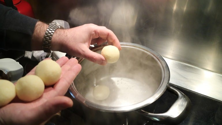 Put the raw dumplings into boiling salted water.