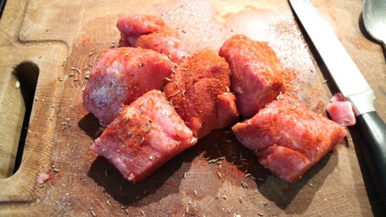 Pork fillet cut into pieces, seasoned with salt, pepper, paprika, and cumin