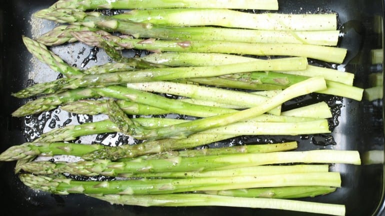 asparagus in the roasting pan before grilling