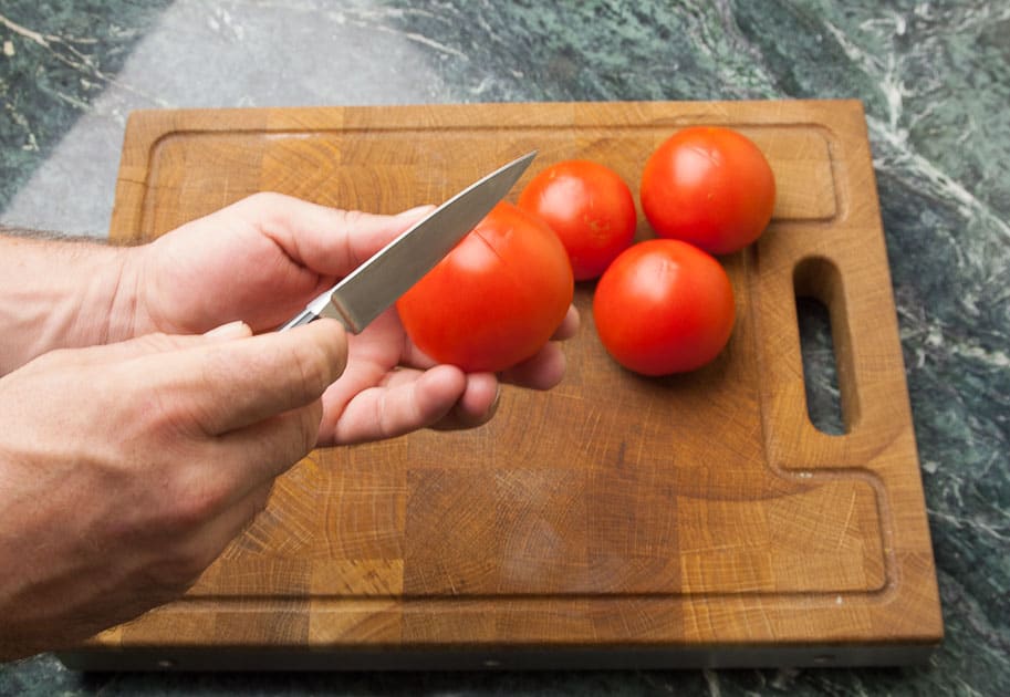 prepare the tomatoes for blanching: tomato-cross-shaped-skin incision