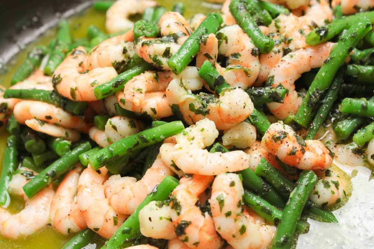 Shrimps and beans in salad marinade, delicious and shining with flavor.