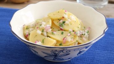 earth apple - potato salad- vienna style - viennese potato salad on a plate