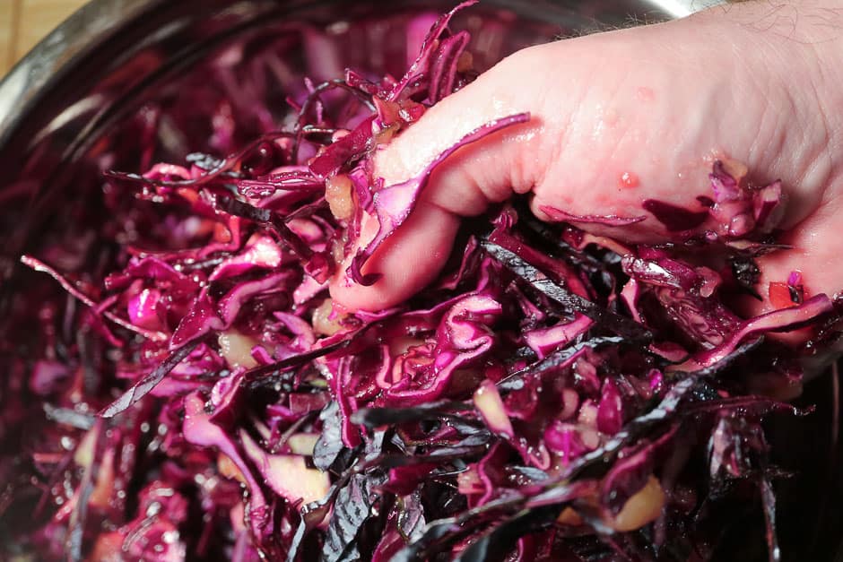 Knead the marinated red cabbage with your hands