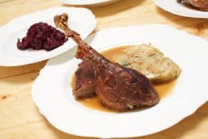 roasted goose with dumplings and red cabbage
