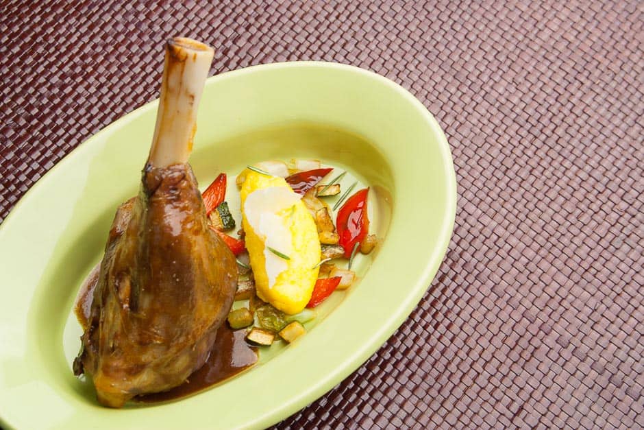 Lamb shank recipe Image of the braised lamb shank with side dishes