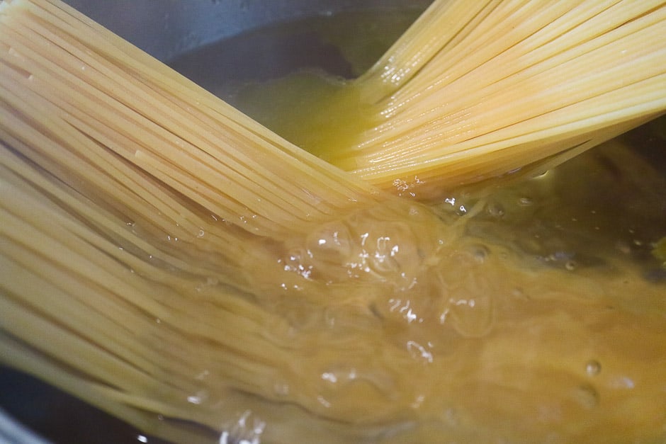 Spaghetti while cooking in a saucepan