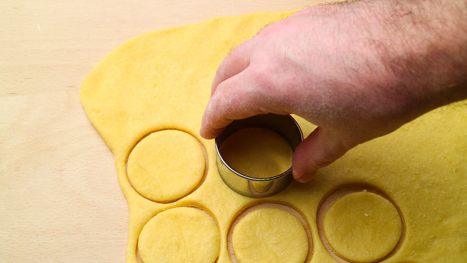 Yeast dough for donuts when cutting out.
