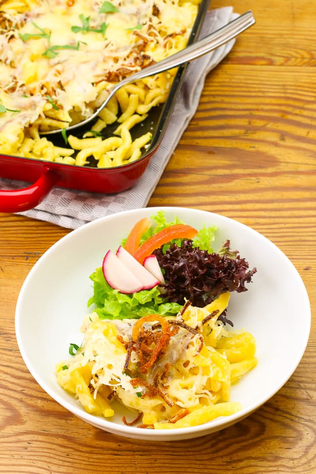 Cheese spaetzle served with salad.