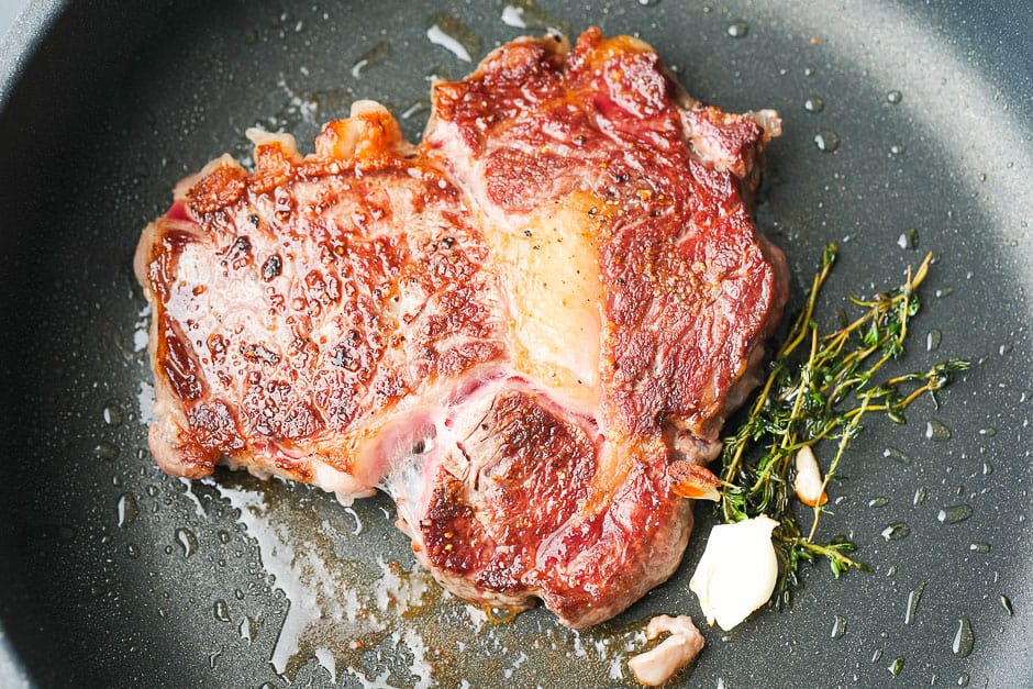Turn the steak over while frying.