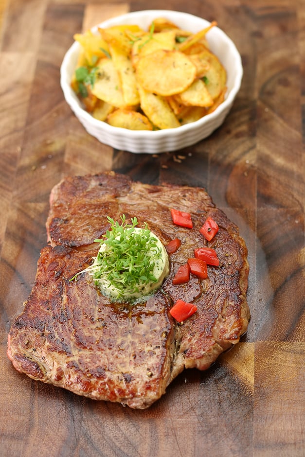 Steak with fried potatoes portrait format picture.