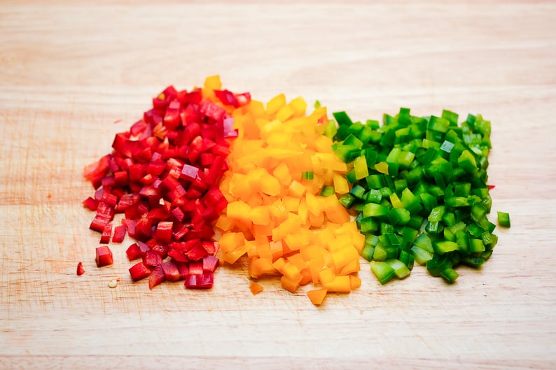 Diced vegetables on a board.