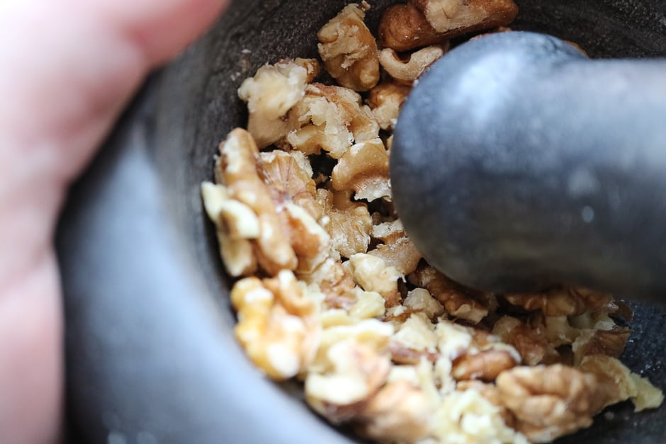Walnuts, walnut kernels in a mortar