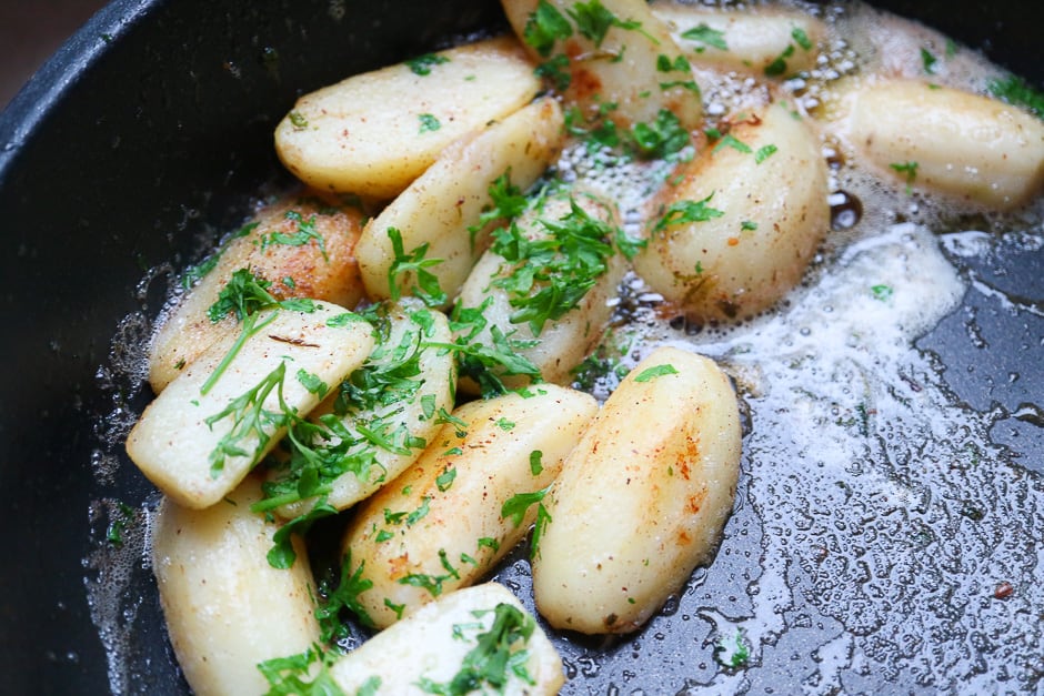 Parsley potatoes in the pan.