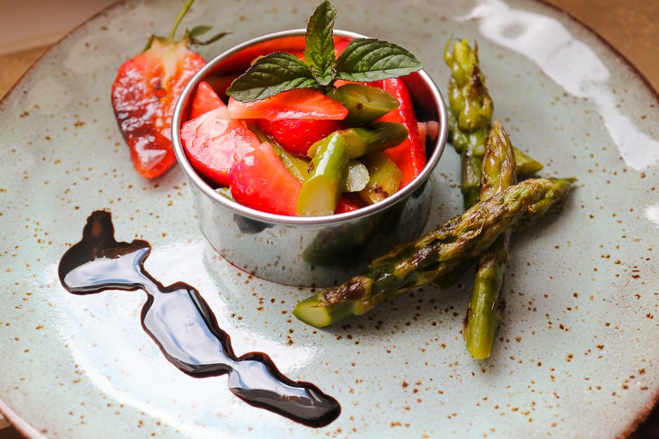 Serve asparagus salad with strawberries.