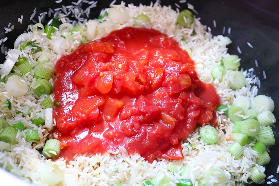 Add the chunky tomatoes to the rice.