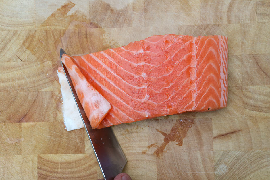 Fold up the belly flap of the salmon fillet