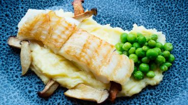 Halibut recipe picture with mashed potatoes, peas and mushrooms