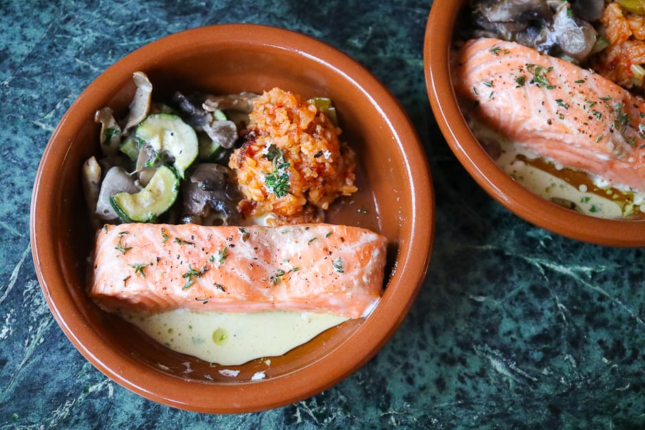 Salmon from the oven, served with a side dish of courgette, mushroom vegetables and tomato rice.