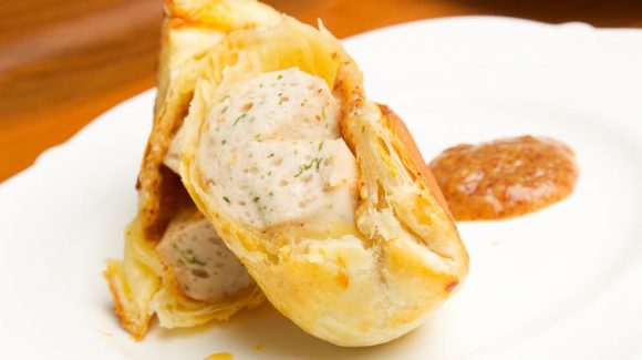 Popular snack and finger food for children's birthday parties: sausages in puff pastry known as sausages in a dressing gown.