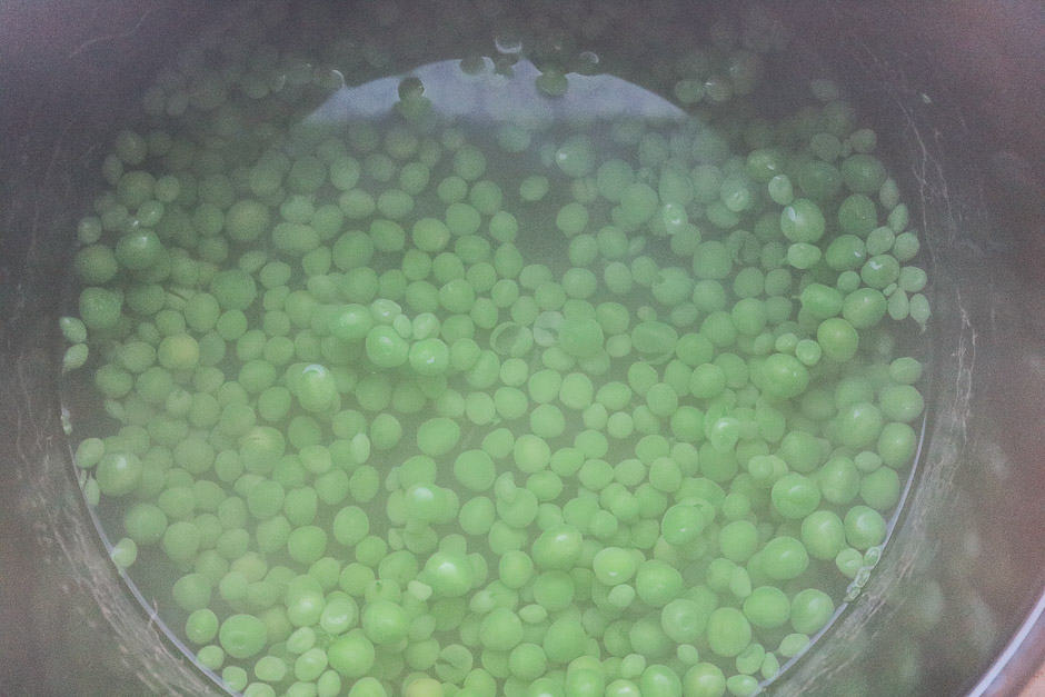 Boil the peas in salted water