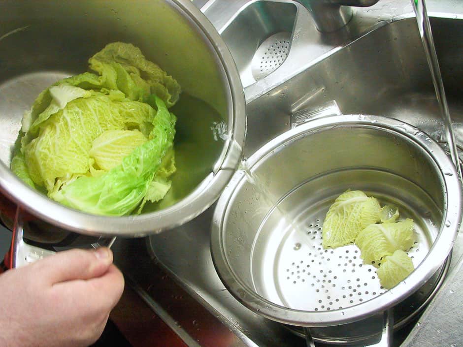 Pour off the savoy cabbage leaves