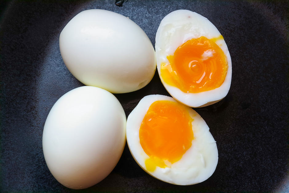 Peeled and soft-boiled eggs