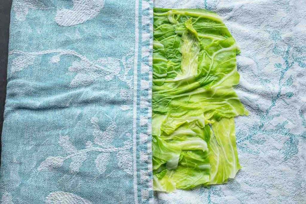 Cauliflower leaves on the kitchen towel