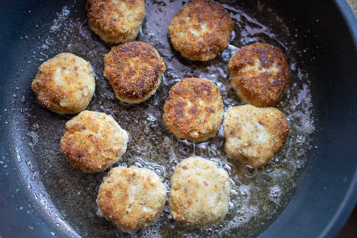 Fry fish meatballs in a pan
