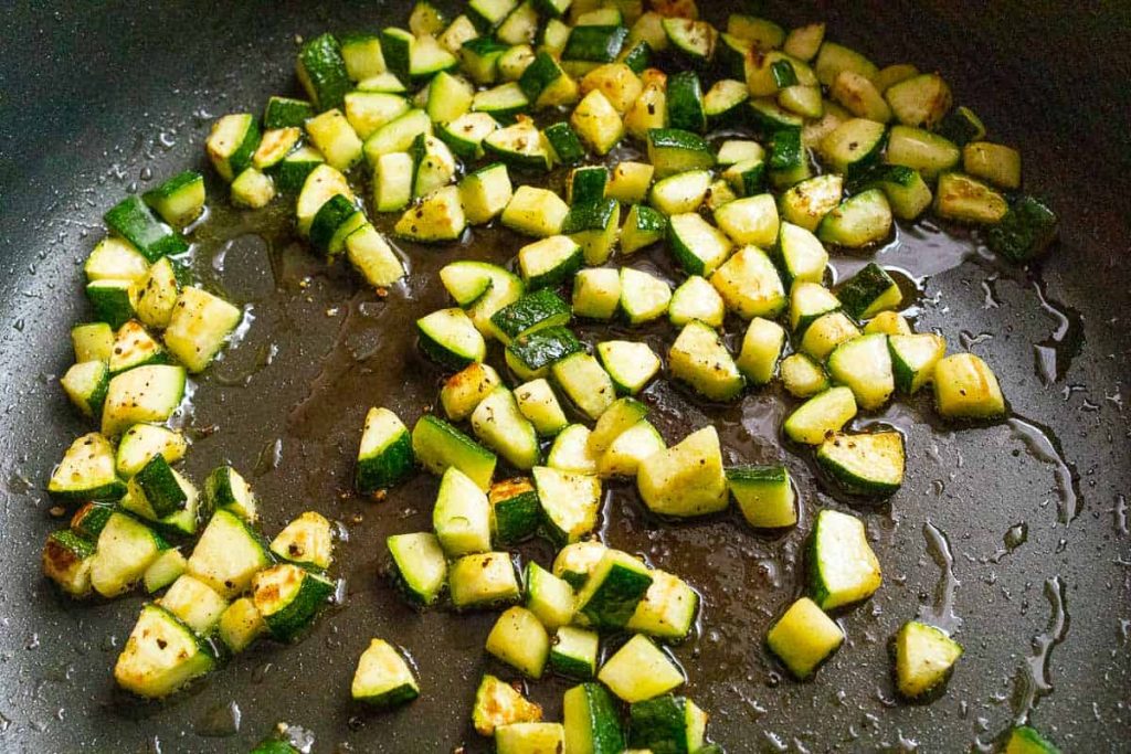 Zucchini cubes in the pan