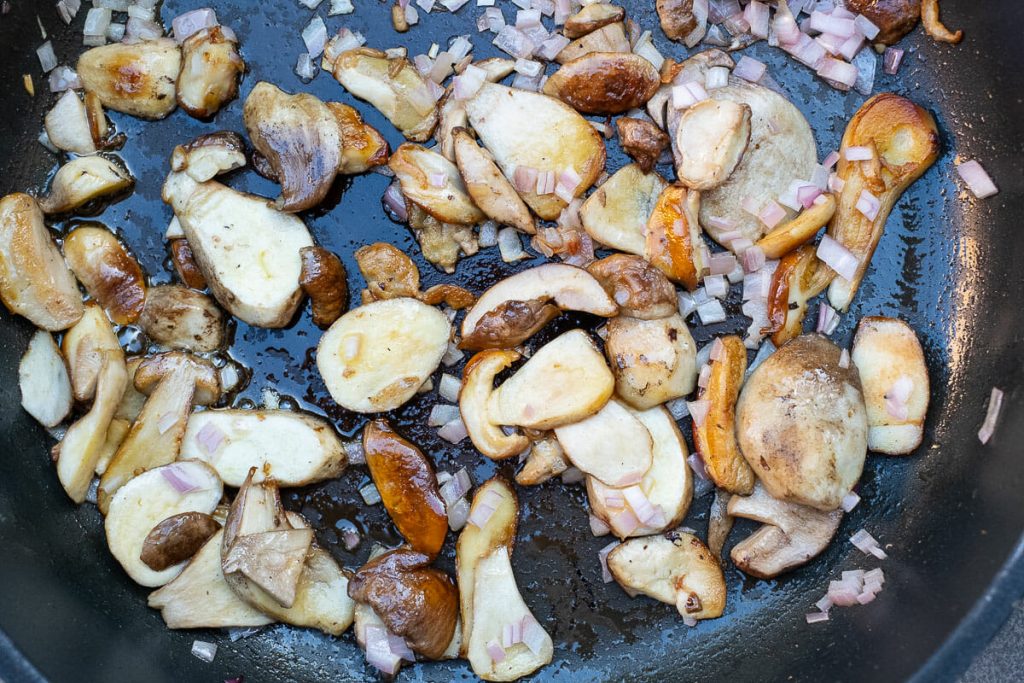 Porcini mushrooms when frying with onion cubes