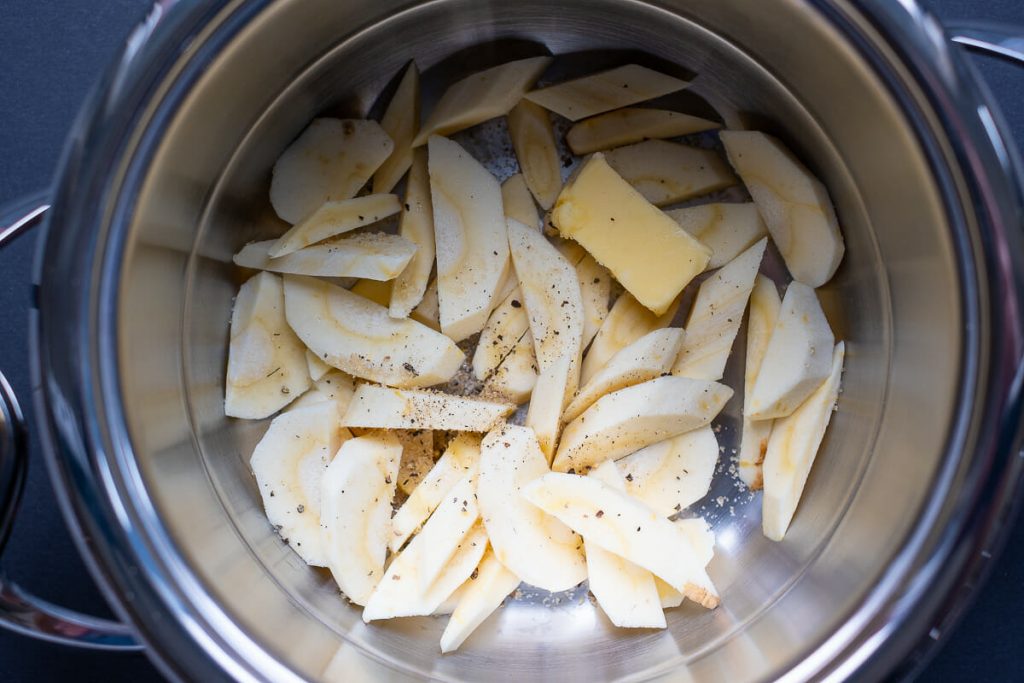 Raw parsnip vegetables in the pot