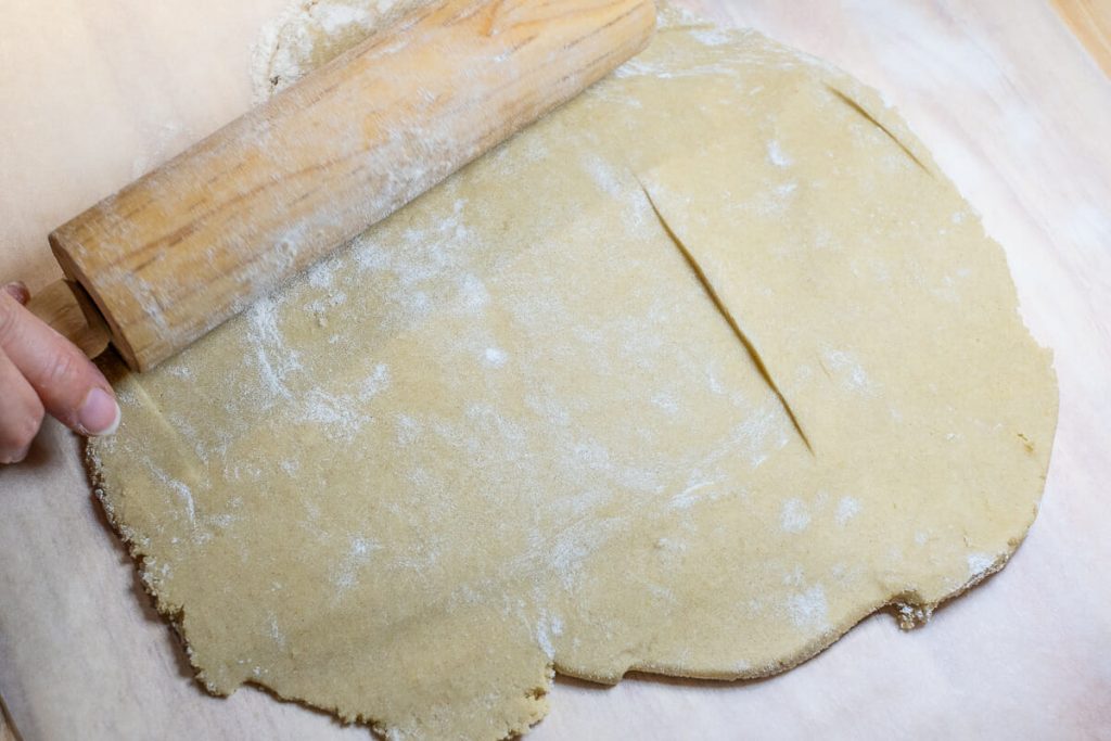 Roll out the shortcrust pastry with a rolling pin