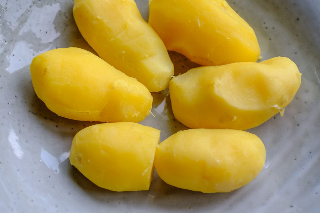 boiled, peeled potatoes