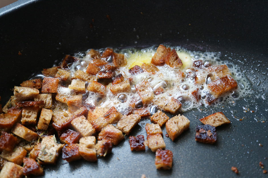 Fry the bread cubes in butter until crispy.