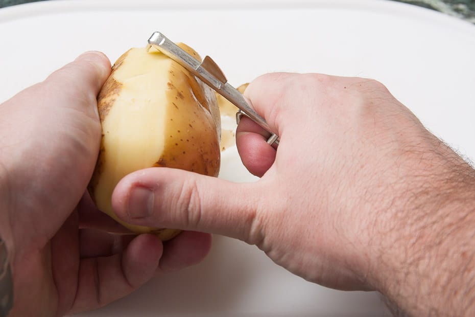 Peel potatoes for french fries