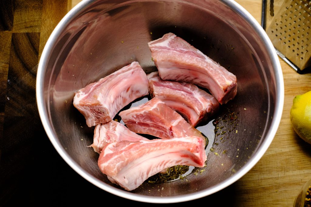 Ribs raw in herb oil