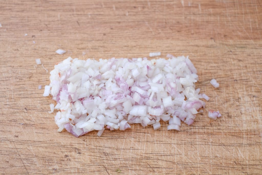 Onion cubes on the cutting board