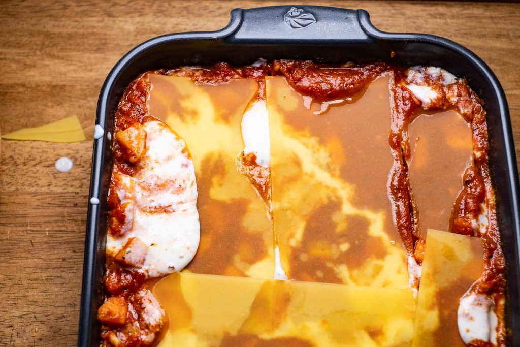 Lay in the lasagne pasta sheets