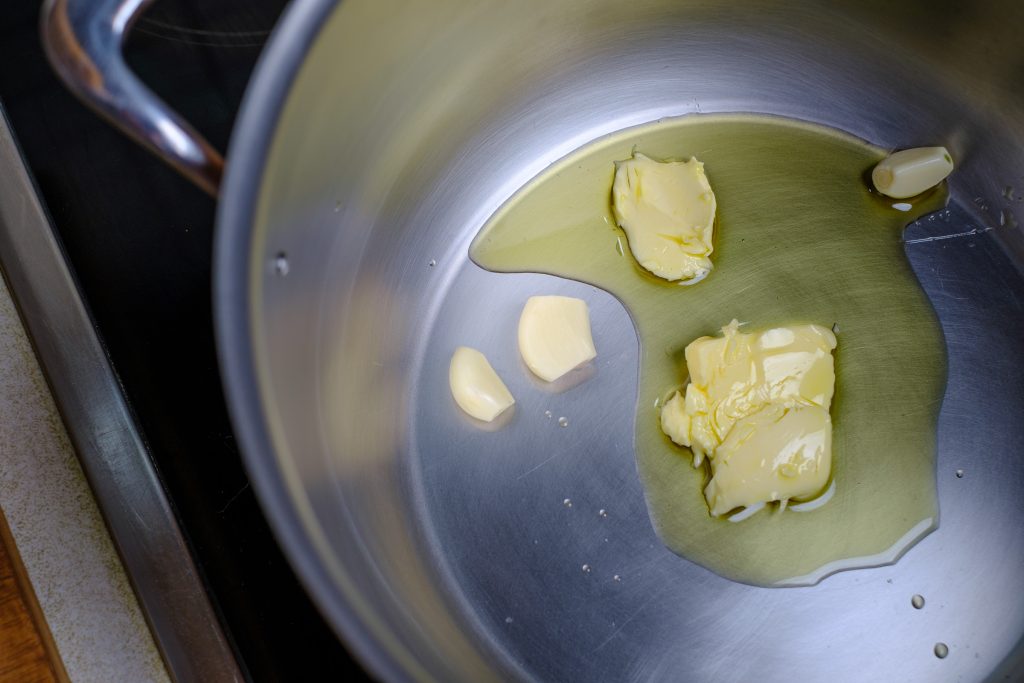 Garlic with butter and oil in saucepan