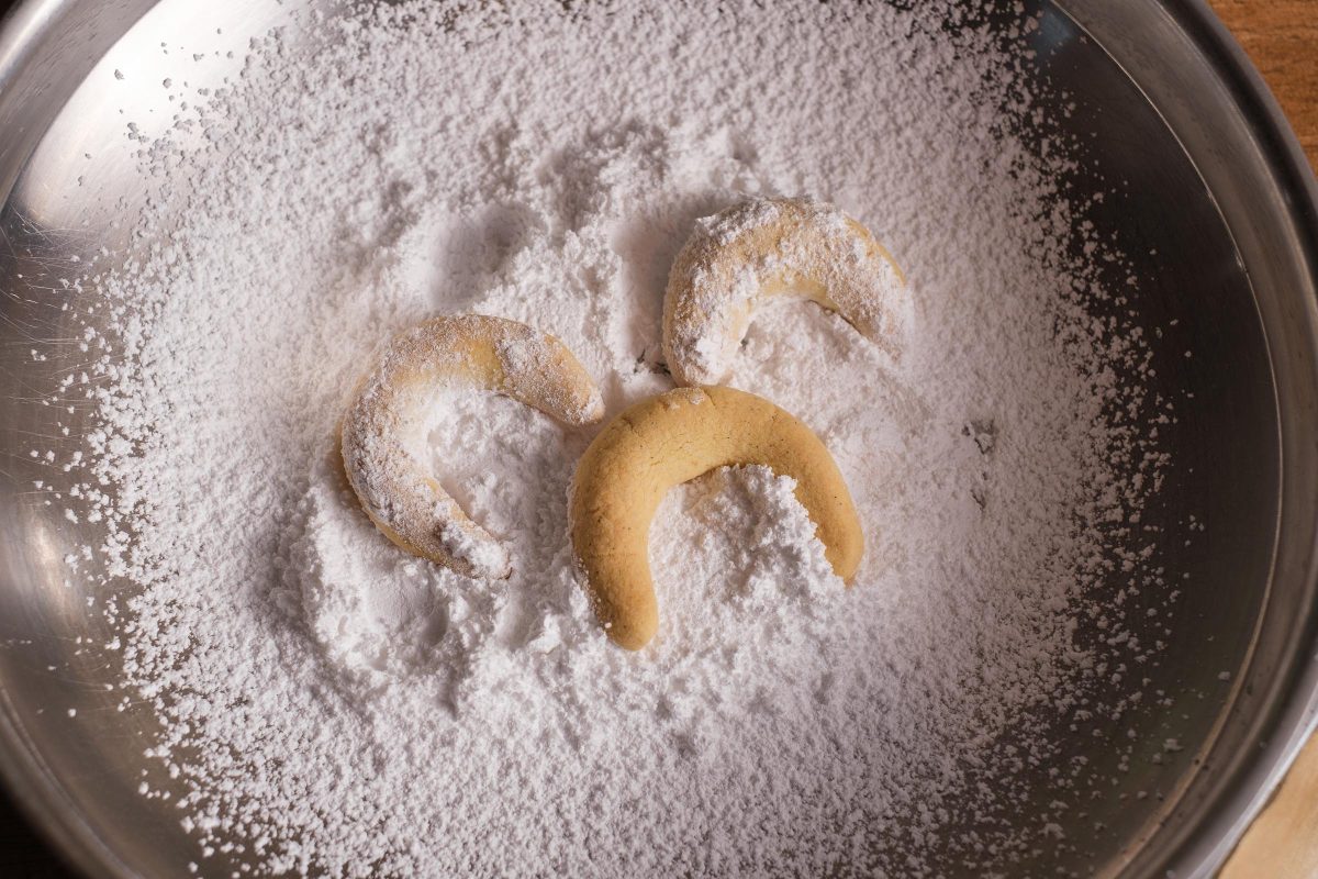 Roll the vanilla croissants in powdered sugar