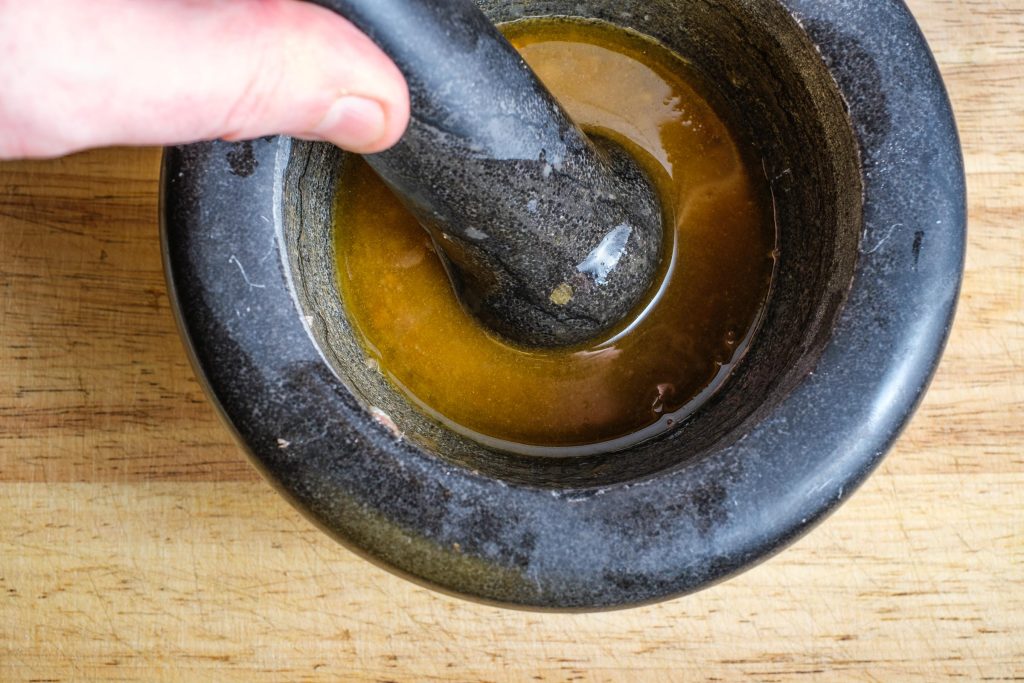 Anchovy vinaigrette in a mortar