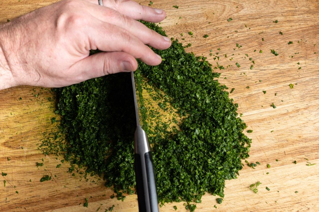 Chop 7 herbs for green sauce