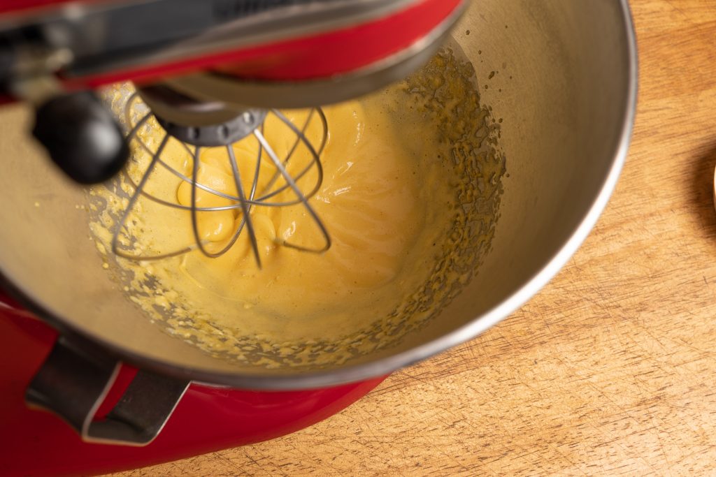 Beat egg yolk in mixing bowl